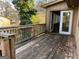 Exterior deck with wood railings and sliding glass door at 1725 Sara Se Ct, Conyers, GA 30013