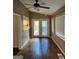 Bright sunroom with wood floors and a ceiling fan at 1725 Sara Se Ct, Conyers, GA 30013