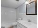 This bathroom features a shower/tub, vanity, and white tiled walls at 3626 Buford # C1, Brookhaven, GA 30329