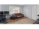 Bedroom featuring a large window with natural light, closet, and neutral carpet at 3626 Buford # C1, Brookhaven, GA 30329