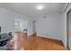 Open living space with hardwood floors and access to adjacent rooms and natural light at 3626 Buford # C1, Brookhaven, GA 30329