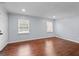 Bright, unfurnished living room features hardwood floors and window with natural light at 3626 Buford # C1, Brookhaven, GA 30329