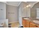 Bathroom with double sink vanity, tile floor, walk-in shower and soaking tub at 85 Parks Pl, Sharpsburg, GA 30277