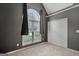 This bedroom features a neutral carpet, a large window, and a spacious closet for ample storage at 85 Parks Pl, Sharpsburg, GA 30277
