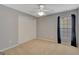 Spacious bedroom with neutral walls, carpeted floors, and a double-door closet for ample storage at 85 Parks Pl, Sharpsburg, GA 30277