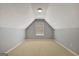 Bonus room with neutral carpet and walls and one window at 85 Parks Pl, Sharpsburg, GA 30277