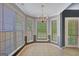 Charming dining room illuminated by a chandelier, offering great natural light at 85 Parks Pl, Sharpsburg, GA 30277