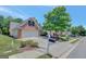 Well-maintained brick home with an attached garage and landscaping at 85 Parks Pl, Sharpsburg, GA 30277