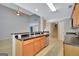 Kitchen view highlighting the bar and transition to the dining and living spaces at 85 Parks Pl, Sharpsburg, GA 30277