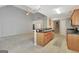 Open kitchen features an island with sink and views to the living area at 85 Parks Pl, Sharpsburg, GA 30277