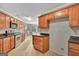 Functional kitchen featuring stainless steel appliances and ample cabinet space at 85 Parks Pl, Sharpsburg, GA 30277