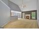 Spacious living room featuring a fireplace, ceiling fan, and lots of natural light at 85 Parks Pl, Sharpsburg, GA 30277