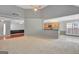Spacious living room offering open floor plan to kitchen and dining area, perfect for entertaining at 85 Parks Pl, Sharpsburg, GA 30277