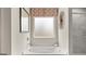 Close up on a tub with frosted glass window allowing plenty of natural light at 310 Sound Circle, Stockbridge, GA 30281