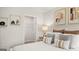 Inviting bedroom featuring a comfortable bed, neutral decor, closet, and a side table with lamp at 310 Sound Circle, Stockbridge, GA 30281