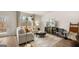 Inviting living room with a cozy sofa, stylish decor, and large windows with nature views at 310 Sound Circle, Stockbridge, GA 30281