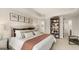 Comfortable main bedroom featuring carpeted floors, stylish decor, and natural light at 310 Sound Circle, Stockbridge, GA 30281