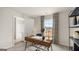 Bedroom staged as a home office space with window views and adjacent bathroom at 310 Sound Circle, Stockbridge, GA 30281