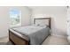 Neutral bedroom with carpet, bed, a window, and a door at 361 Traditions Ln, Hampton, GA 30228