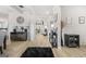 Welcoming entryway with light wood floors, decorative accents, and stylish furnishings creating an inviting ambiance at 361 Traditions Ln, Hampton, GA 30228