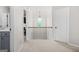 Upstairs hallway with grey bathroom vanity visible at 361 Traditions Ln, Hampton, GA 30228