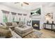 Living area features a fireplace, media center and large sofa set at 361 Traditions Ln, Hampton, GA 30228