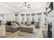 Open floor plan with large living room, fireplace, and view of the kitchen at 361 Traditions Ln, Hampton, GA 30228