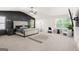 Large primary bedroom featuring a king size bed, and accent wall at 361 Traditions Ln, Hampton, GA 30228