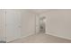 Unfurnished bedroom shows closet entrance, plush carpet, and neutral paint at 314 Sound Cir, Stockbridge, GA 30281