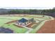 An aerial view of the community space featuring a playground, pavilion, and green space at 314 Sound Cir, Stockbridge, GA 30281