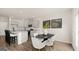 Open dining area showcases a stylish table, chairs, and a view into the kitchen at 314 Sound Cir, Stockbridge, GA 30281