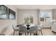 Dining room features a modern round table, six chairs, and natural light at 314 Sound Cir, Stockbridge, GA 30281