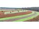 Planned green space within the community with newly planted trees and walking path at 314 Sound Cir, Stockbridge, GA 30281