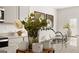 Close-up of kitchen island featuring granite counters, sink, and floral decorations at 314 Sound Cir, Stockbridge, GA 30281