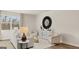 Bright living room features neutral colors, stylish decor, and large window views at 314 Sound Cir, Stockbridge, GA 30281