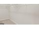 Spacious walk-in closet with ample shelving and storage, providing organizational convenience at 314 Sound Cir, Stockbridge, GA 30281
