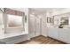 Clean bathroom featuring a glass shower, soaking tub, and double sink vanity at 318 Sound Circle, Stockbridge, GA 30281