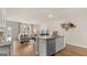 Modern kitchen features a large island, granite countertops, and stainless steel dishwasher at 318 Sound Circle, Stockbridge, GA 30281