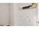 A bright laundry room featuring a shelf with decor and essential hookups at 318 Sound Circle, Stockbridge, GA 30281
