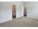 Neutral bedroom with carpet and two bathroom entrances at 1676 Fuma Leaf Way # 305, Mcdonough, GA 30253