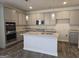 Modern kitchen features gray cabinets, granite countertops, stainless steel appliances, and an island at 1676 Fuma Leaf Way # 305, Mcdonough, GA 30253