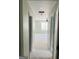 Hallway leading to room with ceiling fan and large window, showcasing bright and open space at 8035 Buffet Trl, Riverdale, GA 30296