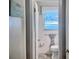 Bathroom featuring white tiled wall, toilet and window at 107 Woodhaven Dr, Stockbridge, GA 30281