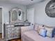 Bedroom featuring a daybed, hardwood floors, decorative mirror and dresser at 107 Woodhaven Dr, Stockbridge, GA 30281