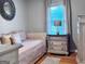 Bedroom featuring a daybed, hardwood floors and dresser at 107 Woodhaven Dr, Stockbridge, GA 30281
