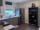 Modern kitchen with sleek stainless steel appliances and stylish grey cabinetry, offering ample storage at 107 Woodhaven Dr, Stockbridge, GA 30281