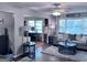 Bright living area with large windows, stylish decor, and an inviting atmosphere for relaxation and gatherings at 107 Woodhaven Dr, Stockbridge, GA 30281