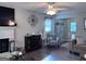 Living room featuring a decorative fireplace, hardwood floors and a sitting area at 107 Woodhaven Dr, Stockbridge, GA 30281