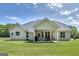 Backyard with a covered patio perfect for relaxing or entertaining with a well-maintained lawn at 433 Wilson Dr, Mcdonough, GA 30252