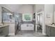 Beautiful bathroom features a soaking tub, tiled shower, granite countertops, and tiled floors at 433 Wilson Dr, Mcdonough, GA 30252